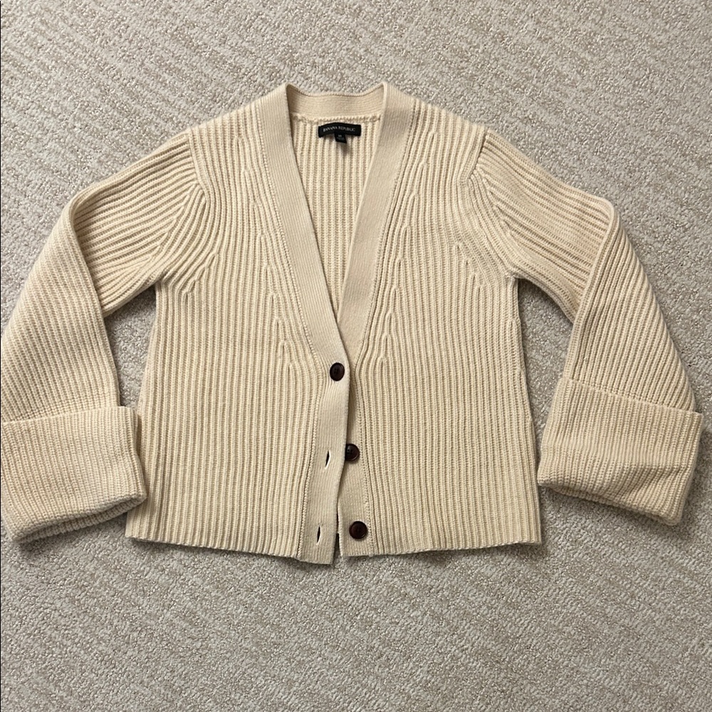 Wool / cashmere cream cardigan sweater with cuffed sleeves.